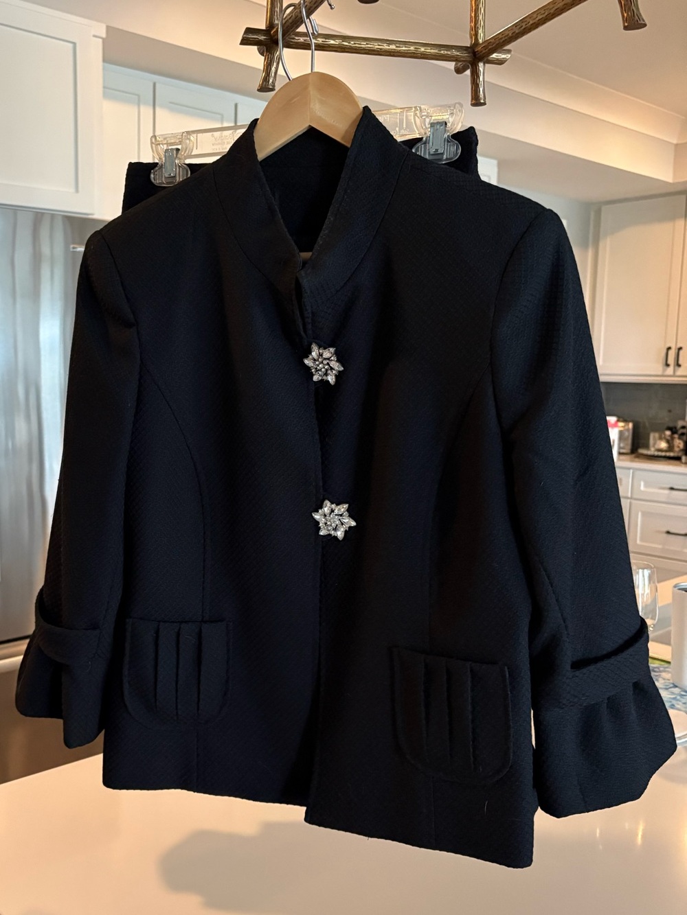 Classic Black Women's Jacket with Decorative Brooch Buttons.